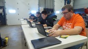Section 2 Students undergoing basic automotive electrical theory testing.