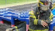 Fire-Rescue-EMR students undergoing SCBA training on the preschool lab playground.