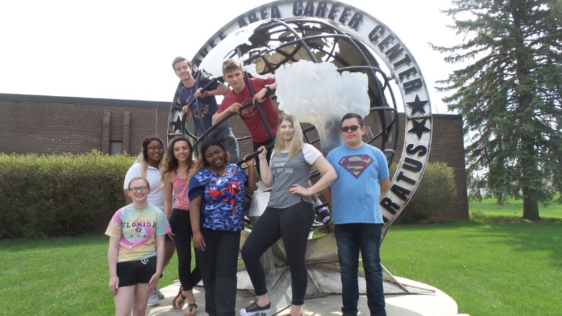 Students having fun on KACC Globe at Front of School.