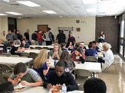 Student Volunteers and their instructors sharing a lunch break.