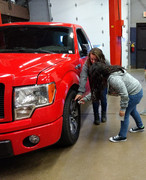 KACC Auto Tech student demos learned skills.