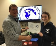 Lucas Papineau on left, giving Taylor Wolter a gift card as an award.