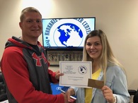 Ava Licka, Medical Terminology-Basic Health Skills Student from Manteno High School Receives her award from KACC Dean, Mr. Papineau