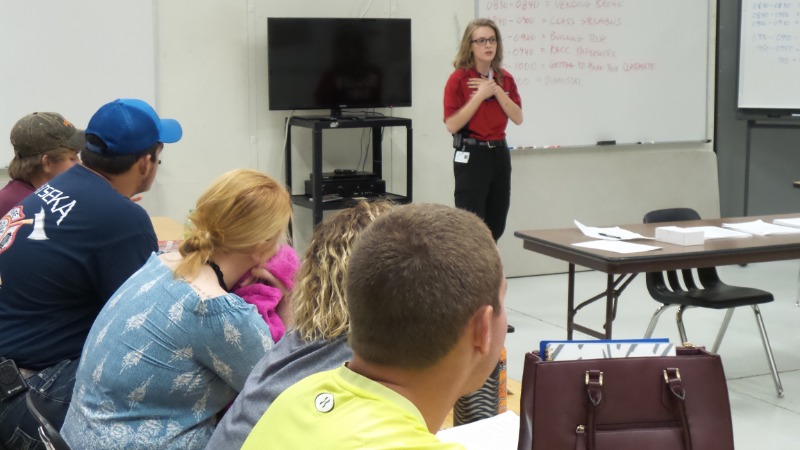 Amelia speaking with students