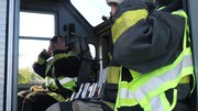 Two Fire-Rescue-Ems students inside fire engine.