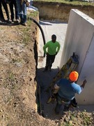 Installation process of precast and pre-studded walls for basement.