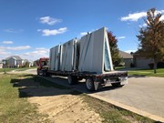 Installation process of precast and pre-studded walls for basement.