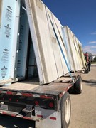 Installation process of precast and pre-studded walls for basement.