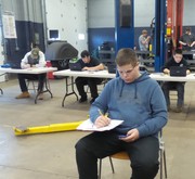Section 2 Students undergoing basic automotive electrical theory testing.