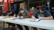 Section 2 Students undergoing basic automotive electrical theory testing.