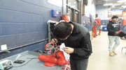Section 3 Students undergoing basic automotive electrical theory testing.
