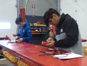 Section 3 Students undergoing basic automotive electrical theory testing.