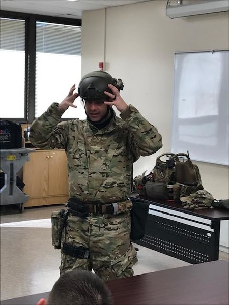 Officer Andy Cox Demonstrates donning his gear