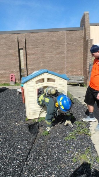 Fire-Rescue-EMR students undergoing SCBA training on the preschool lab playground.