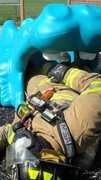 Fire-Rescue-EMR students undergoing SCBA training on the preschool lab playground.