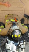 Fire-Rescue-EMR students undergoing SCBA training on the preschool lab playground.