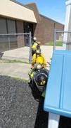 Fire-Rescue-EMR students undergoing SCBA training on the preschool lab playground.