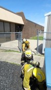 Fire-Rescue-EMR students undergoing SCBA training on the preschool lab playground.