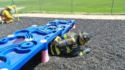 Fire-Rescue-EMR students undergoing SCBA training on the preschool lab playground.