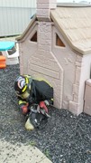 Fire-Rescue-EMR students undergoing SCBA training on the preschool lab playground.
