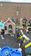 Fire-Rescue-EMR students undergoing SCBA training on the preschool lab playground.