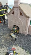 Fire-Rescue-EMR students undergoing SCBA training on the preschool lab playground.