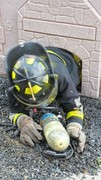 Fire-Rescue-EMR students undergoing SCBA training on the preschool lab playground.