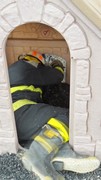 Fire-Rescue-EMR students undergoing SCBA training on the preschool lab playground.