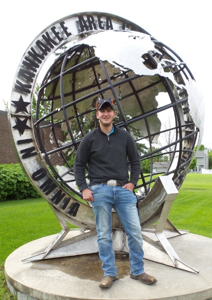 Dalton Grimes standing in front of Career Center's Globe