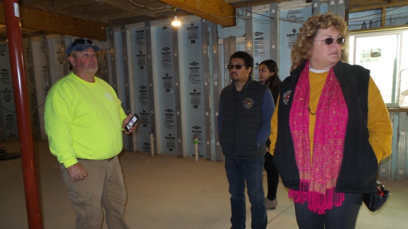 Jeff Umphrey Speaking to State Rep Parkhurst in Basement of New Construction Project.