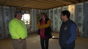 Photos of basement with Umphrey, State Rep Parkhurst and staff