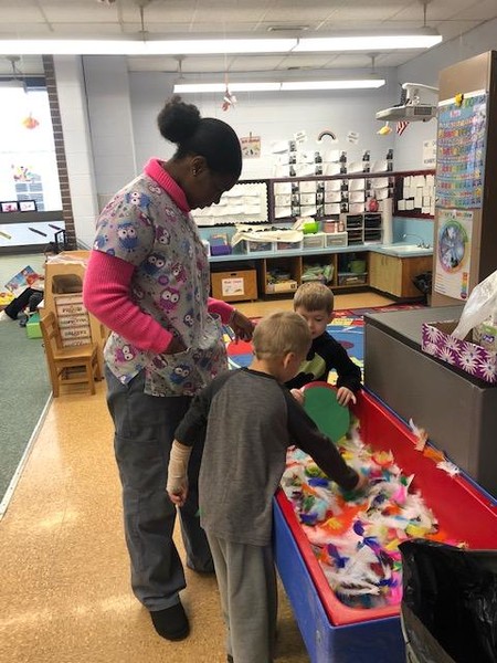 Sensory Table with Feathers