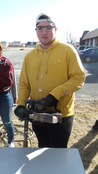 Picture of KACC Student utilizing Jaws of Life to pick up an Egg.