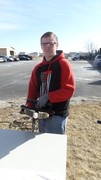 Picture of KACC Student utilizing Jaws of Life to pick up an Egg