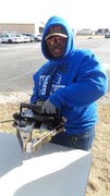 Picture of KACC Student utilizing Jaws of Life to pick up an Egg