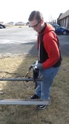 Picture of KACC Student utilizing Jaws of Life to cut into metal.