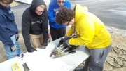 Student using Jaws of Life to pick up an egg