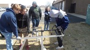 Picture of KACC Student utilizing Jaws of Life to cut into metal.