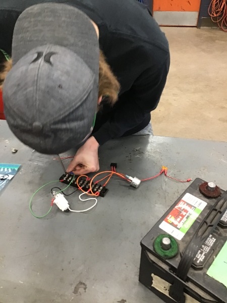 Picture of Nate Bigson working on circuitry.