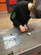 Picture of Nate Bigson working on circuitry.