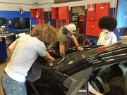 Students working on replacing engine