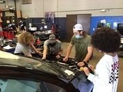 Students working on replacing engine