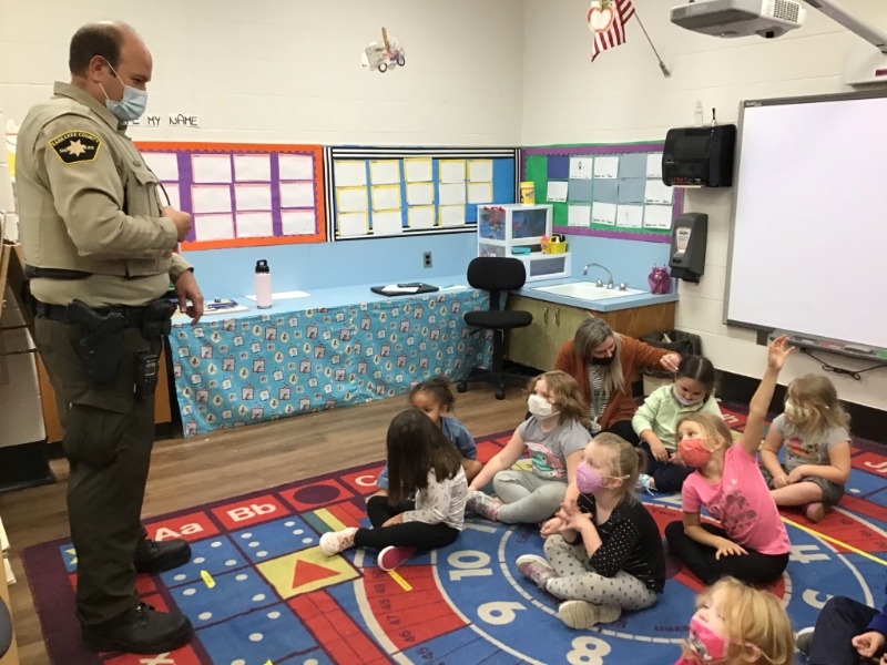 Preschool students listening to Deputy Powell.