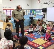 Deputy Powell showing where he keeps his handcuffs.